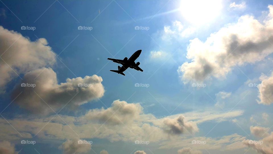 aeroplane in the sky to sun