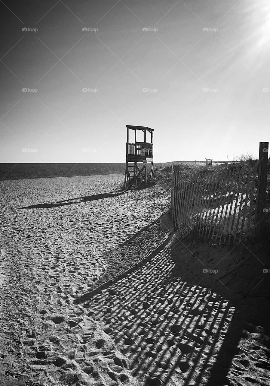 Come to the beach.  The lights and shadows of the beach in the late afternoon are more defined in black and white. 