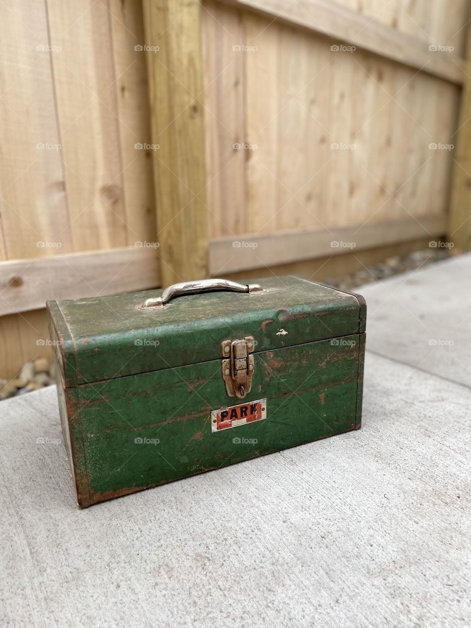 Handyman tool box on patio, home improvement projects about to start, green metal toolbox at home, tool box ready for projects, working at home with tools, vintage tool box
