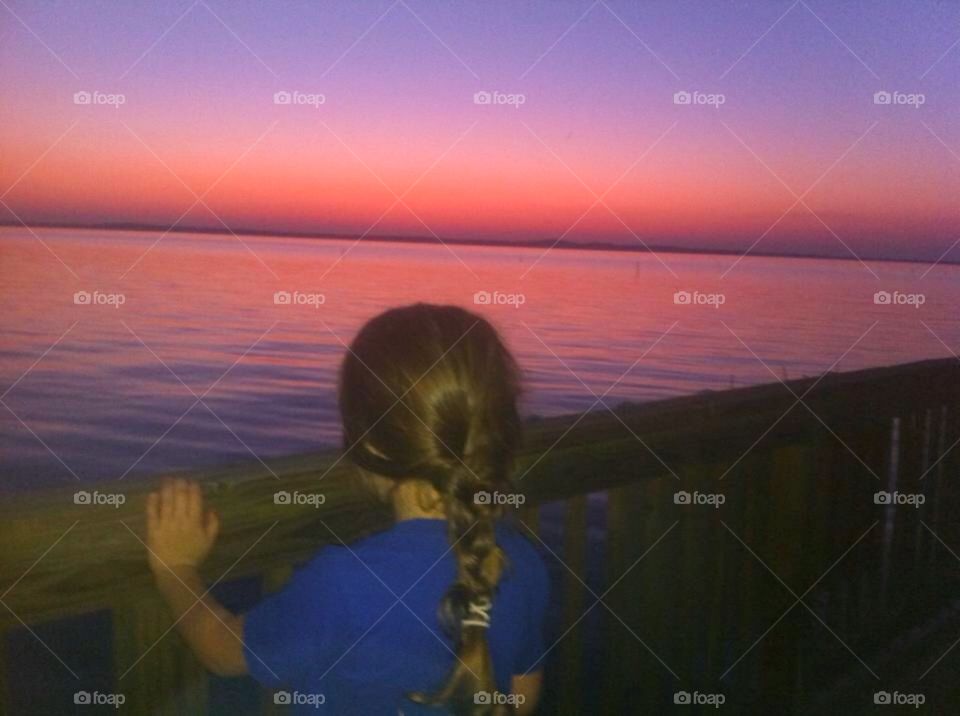 My granddaughter . Our camp on the river