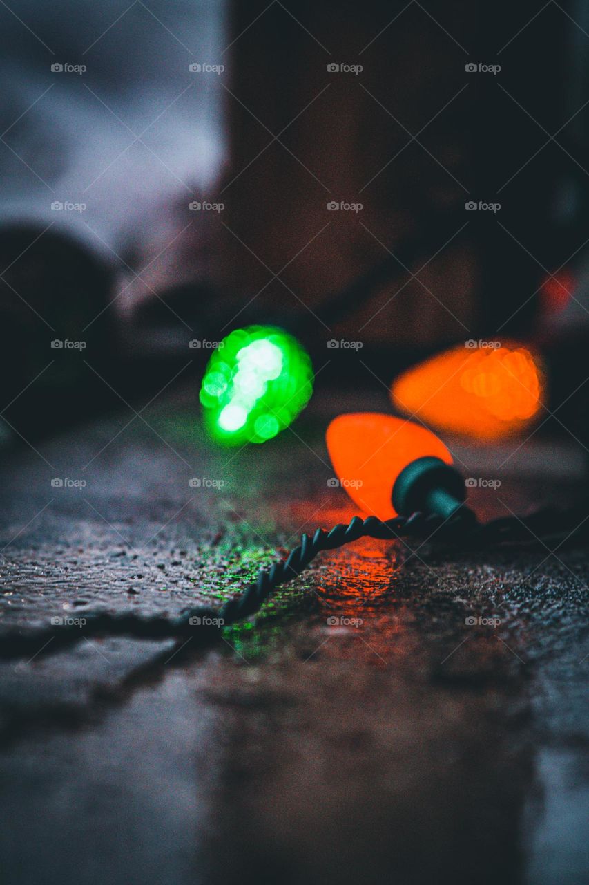 Wet concrete and reflective lights.