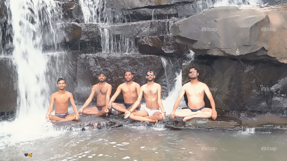 brothers between the waterfall