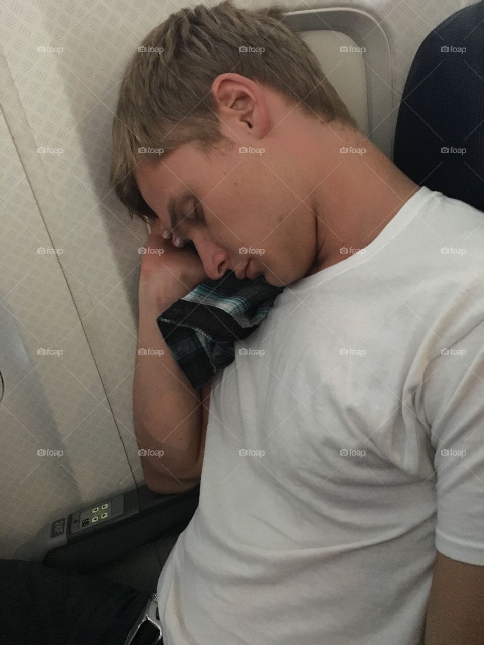 Fell asleep on the plane ride to Seattle, WA! This is my bf of two years. He is Russian, his name is Igo