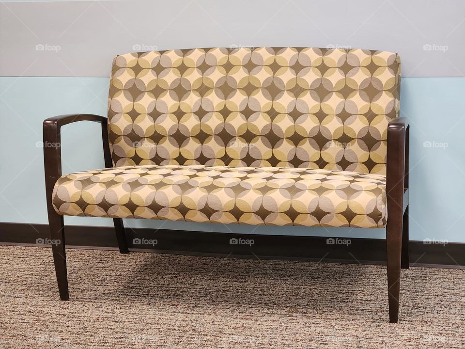 simplistic diamond patterned sofa in doctor office waiting room