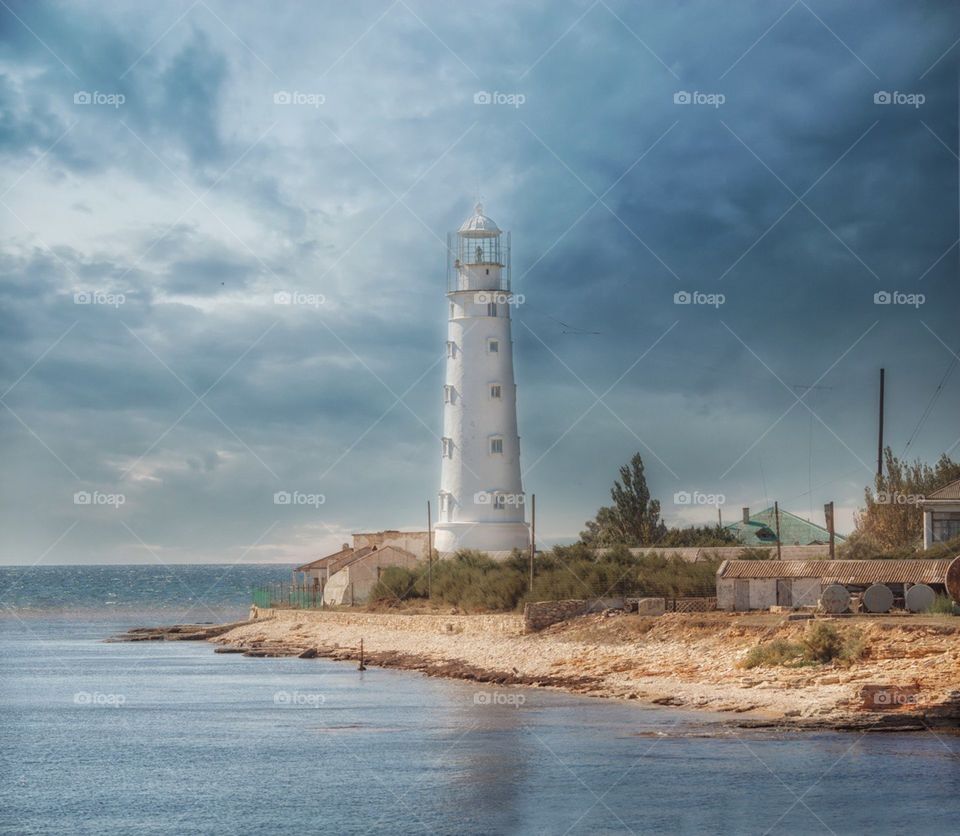 Seascape with lighthouse at sunny day