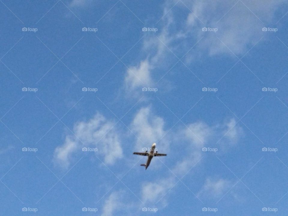 Beautiful airplane flying cross the sky.