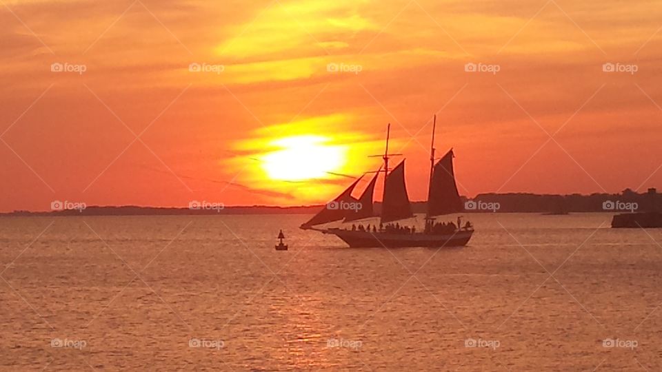 sunset in harbor on sailboat. taken at buffalo ny at erie basin marina summer sunset