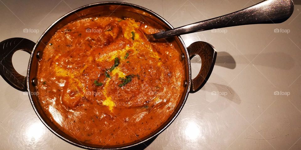 The soup is a style of cuisine and Indian spices called masala