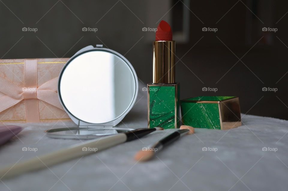 Decorative cosmetics for the face, for bright makeup, red classic lipstick and mirror, makeup sticks, girls' and women's makeup