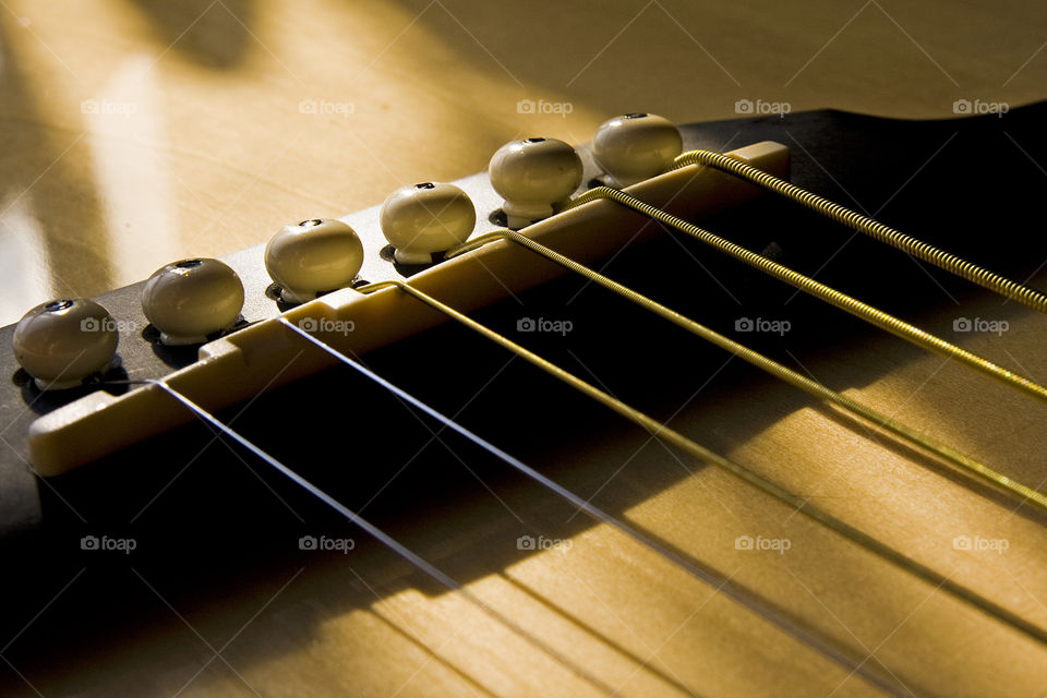 Cropped image of guitar bridge pins