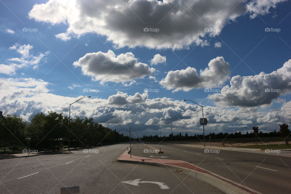 Left Turn Only. Taking a moment to enjoy the view. Sometimes we get lost in everyday life, but its always good to slow down & look up every once in awhile.... Modern day architecture meets natures beautiful cloud paintings in the sky.