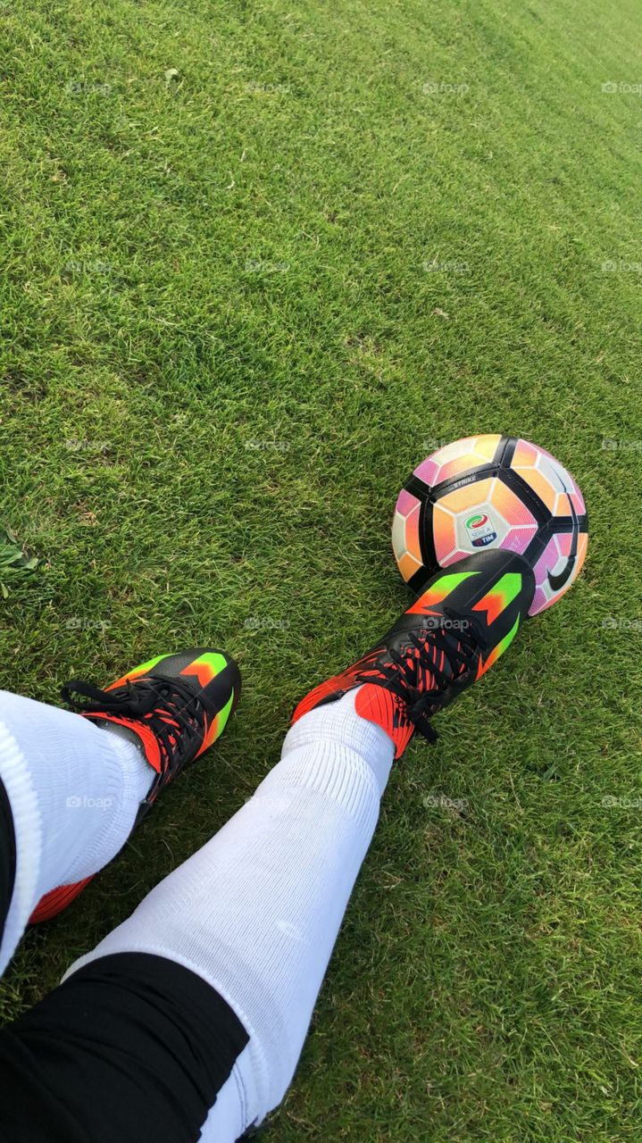 Soccer shoes & pink ball.
