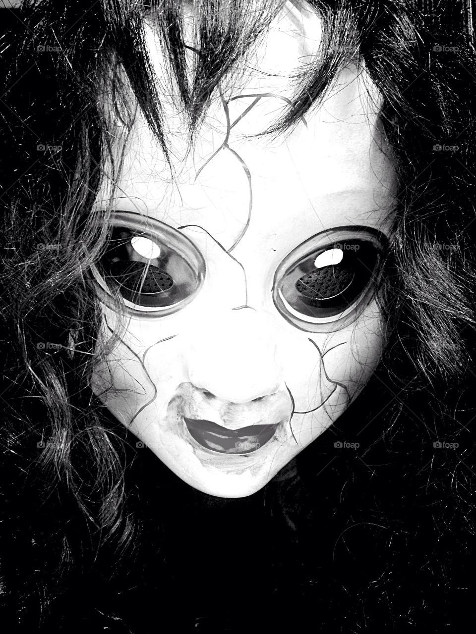 Errie doll with lens eyes
