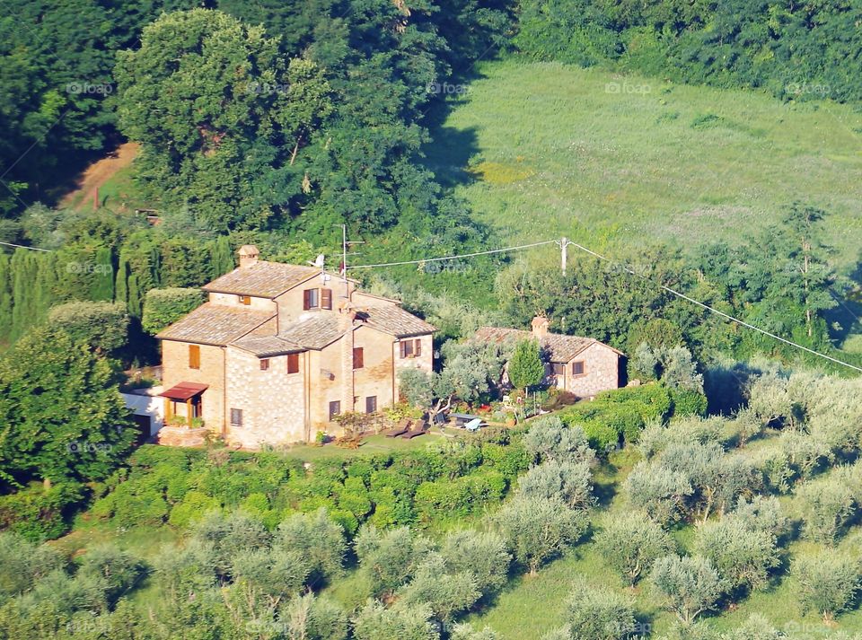 Old original italian house on countryside nature background.
