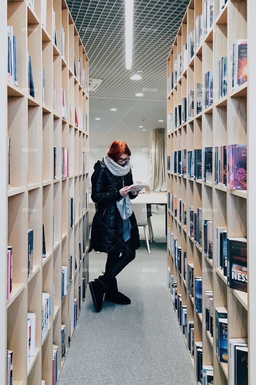 Woman standing in library