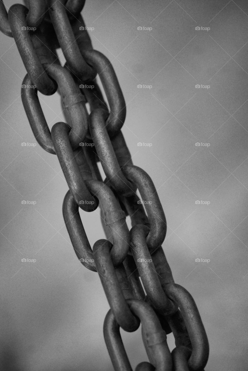 Black and white view of metallic chain