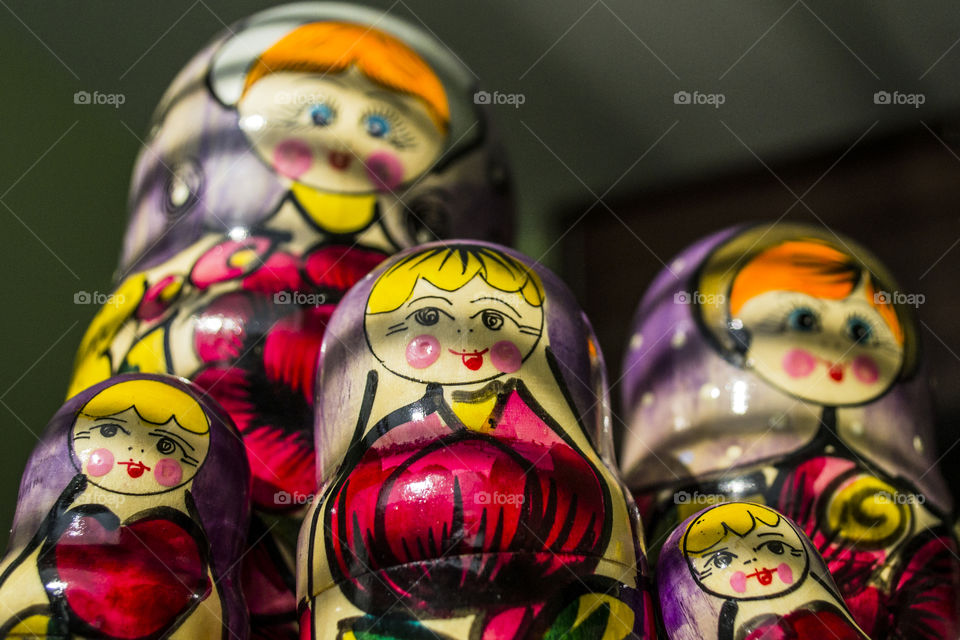 A group of colored wooden Matrioska dolls