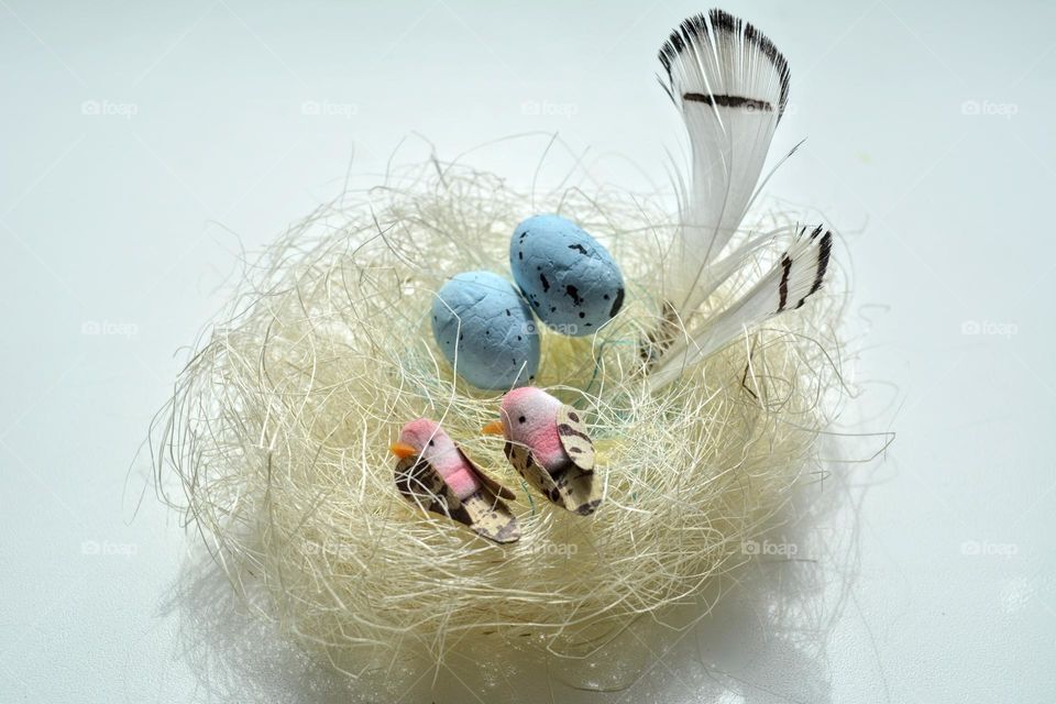 Easter spring holiday decorative birds with eggs in nest