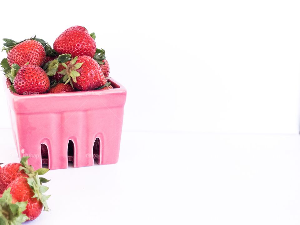 Pink Basket of Strawberries on a white background 