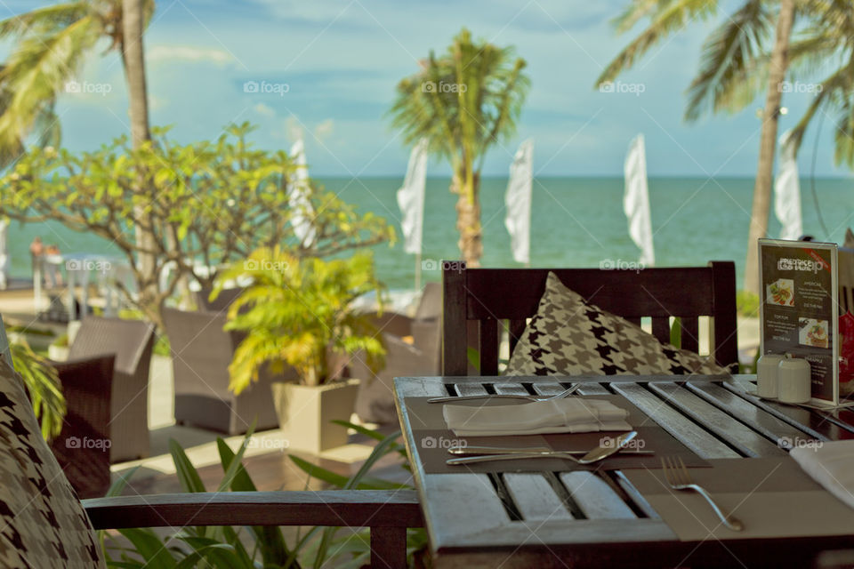 lunch by the beach at a resort . table set up at the terrace