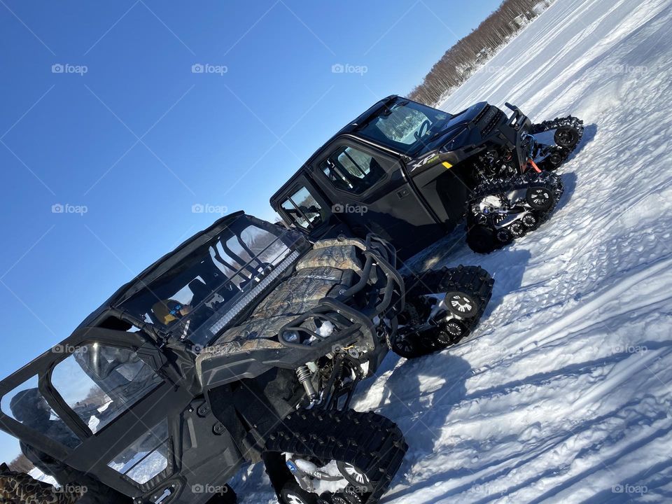 Enclosed UTV with rubber tracks