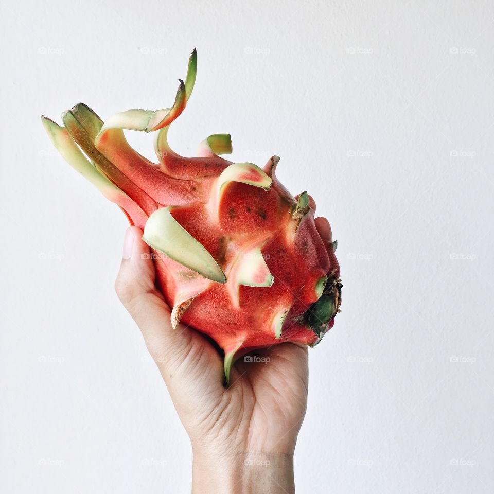 Woman holding pitaya fruit