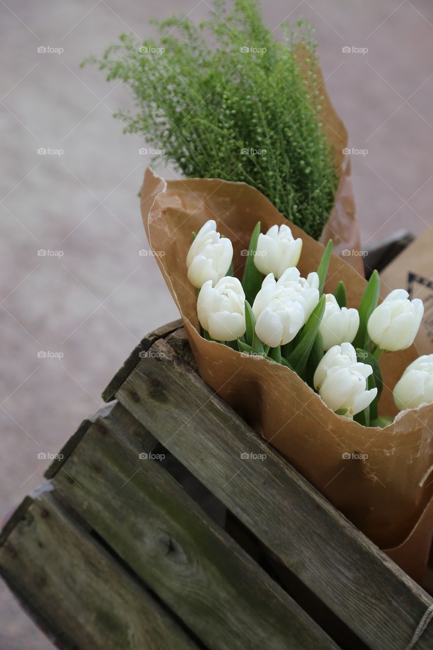 White tulips . White tulips in a old wooden box 