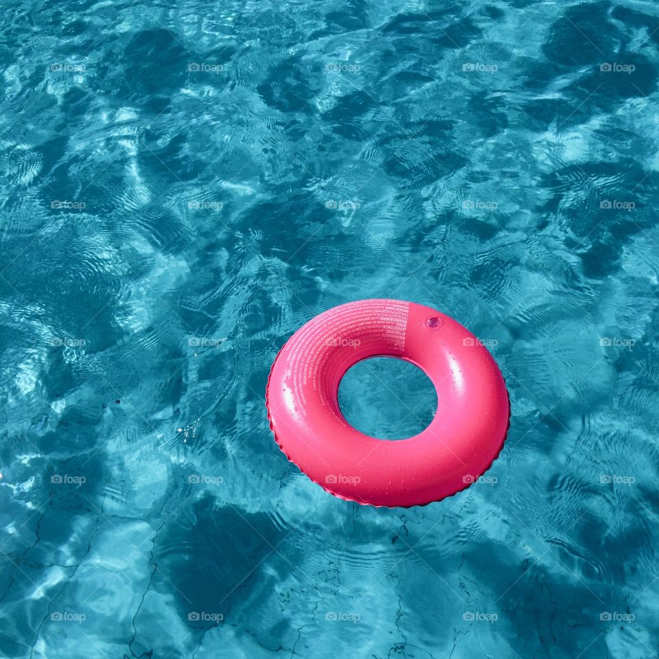 Inflatable ring floating on water