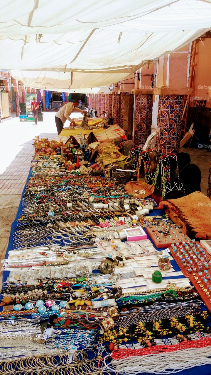 A seller of Jewellery ,beads...etc in a market in Goulimine ,the gate of Sahara,Morocco