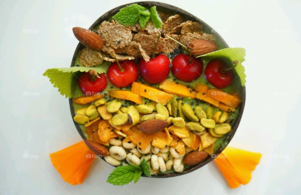 Fresh Fruit Smoothie Bowl - cheery, mango, banana, cereals,  seeds and nuts