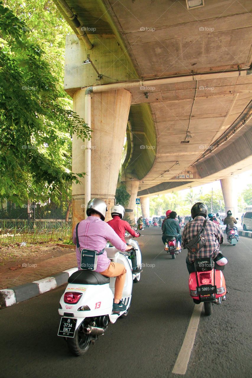 Ride a scooter around town, safe and fun.