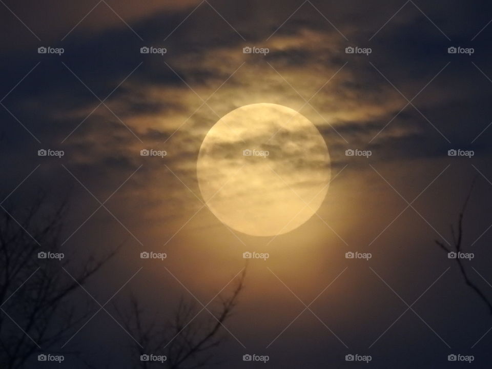 Yellow Moon Behind clouds