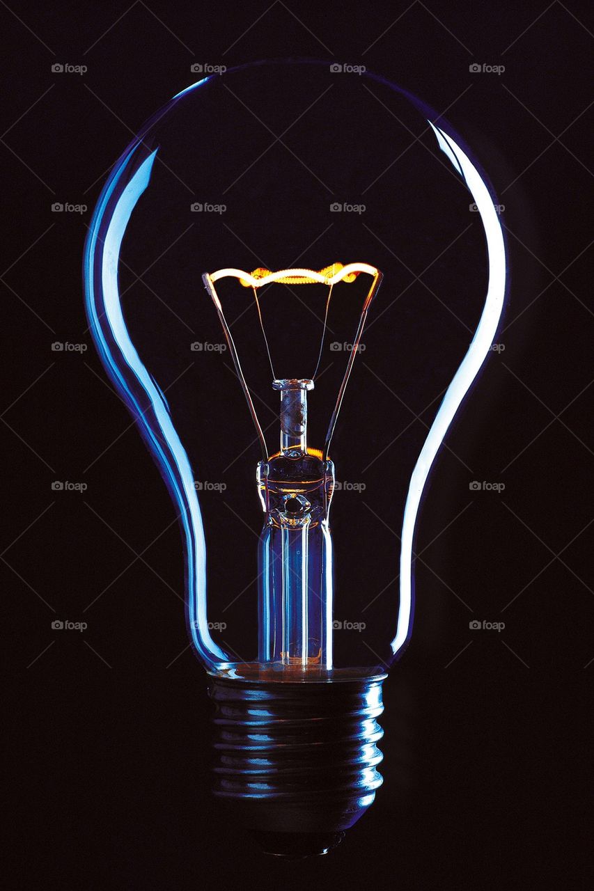 Light bulb on black background