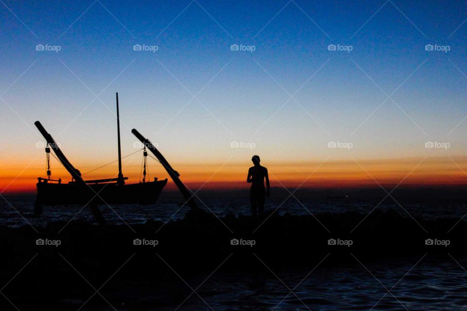 Silhouette of the boat and the guy
