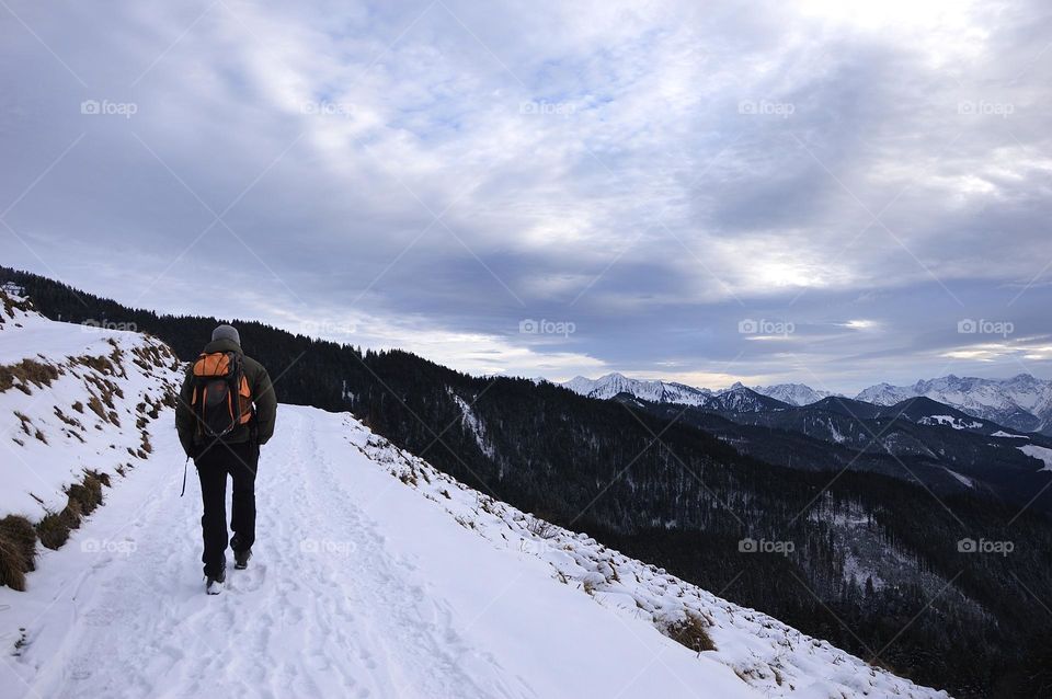 Photo of a young man hiking in the mountains 