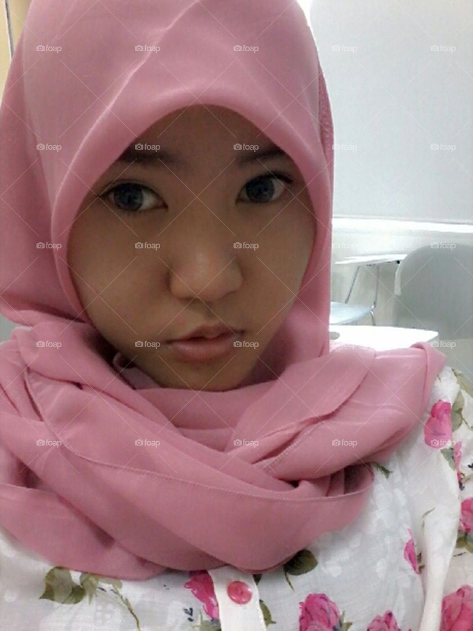 My wife Elisa wearing hijab. My wife wear hijab and took a pictue. She look like a child.