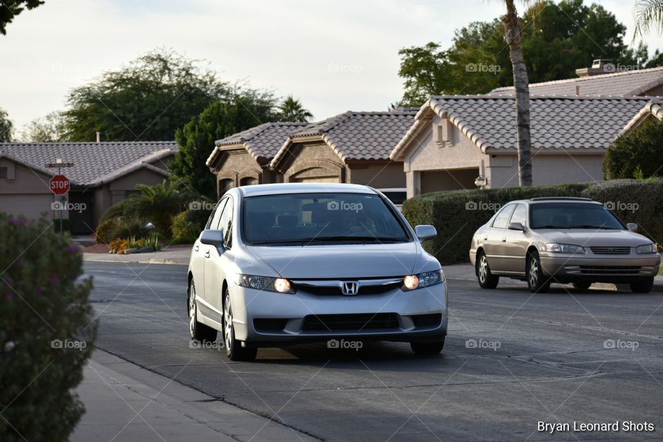Honda driving in suburbs