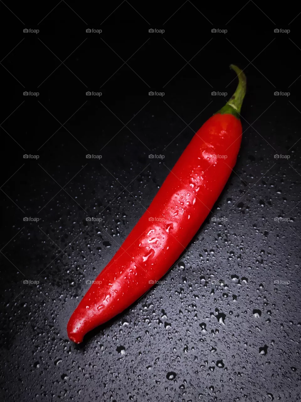 chili pepper on black background