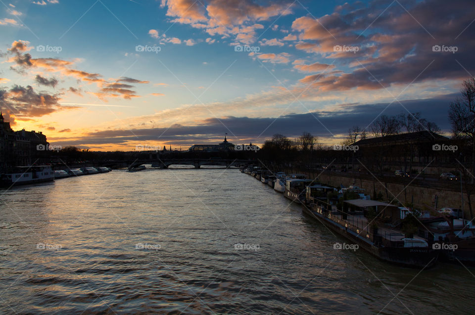 sunset over the river in paris france