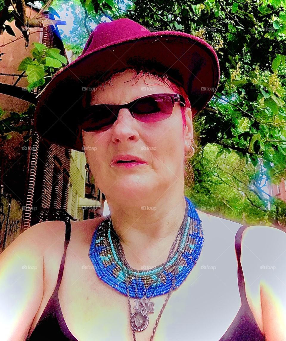 Petra Schiller, photographer, filmmaker, writer, digital multimedia artist born in Germany and a New Yorker for 36 years sits on a stoop in Fort Greene, Brooklyn to enjoy the cool wind on an August afternoon in 2021. Hypnotic Productions