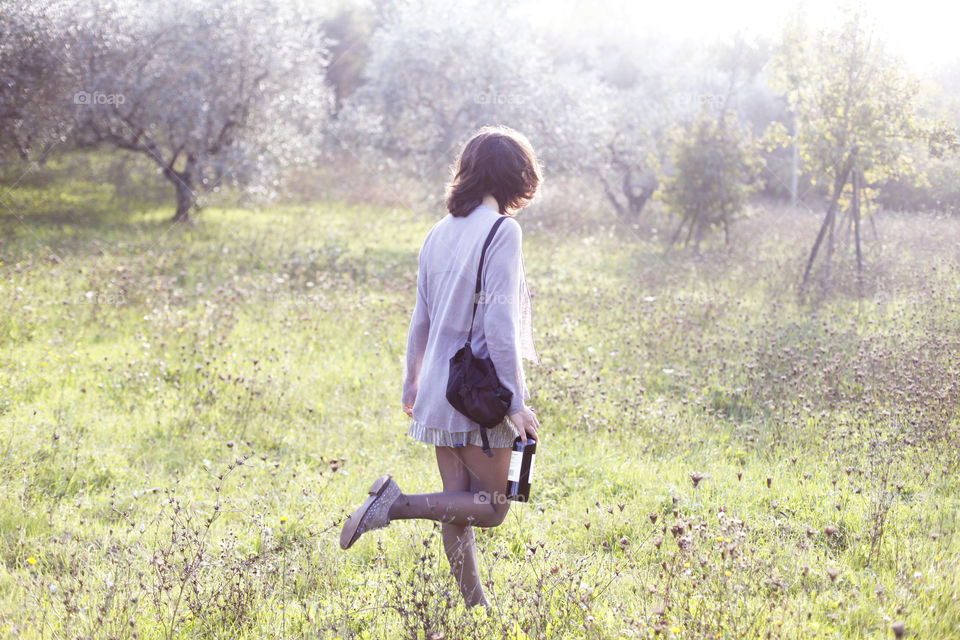 A sunmer tuscan walk with a bottle of wine