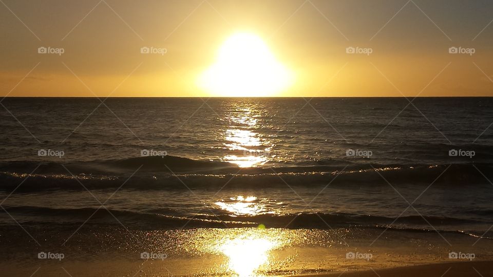 Waves Rollin with the sunset