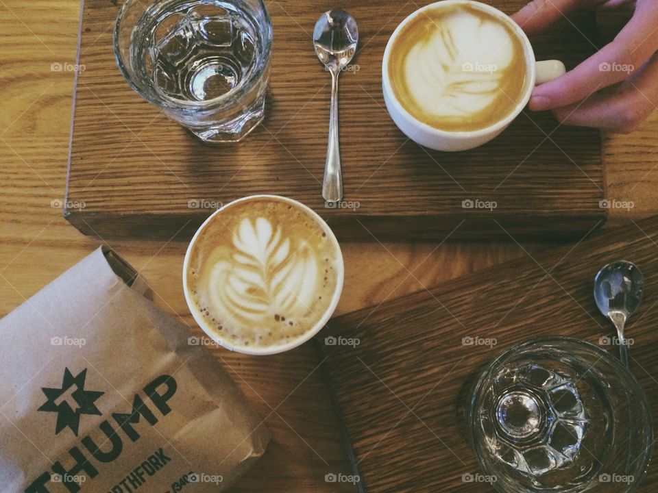 High angle view of cappuccino on wooden table