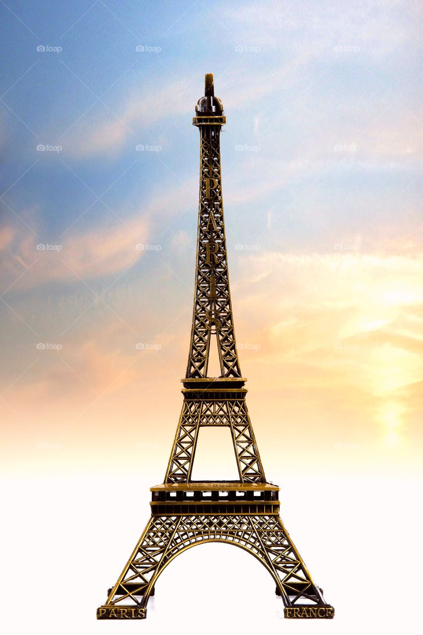 Low angle view of eiffel tower against dramatic sky
