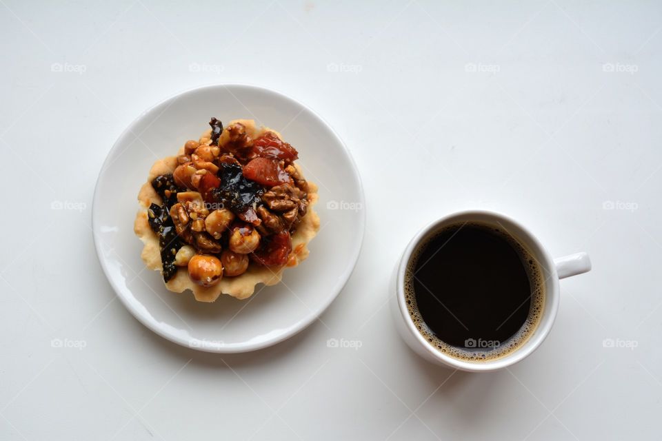 coffee mug and cake on a white background