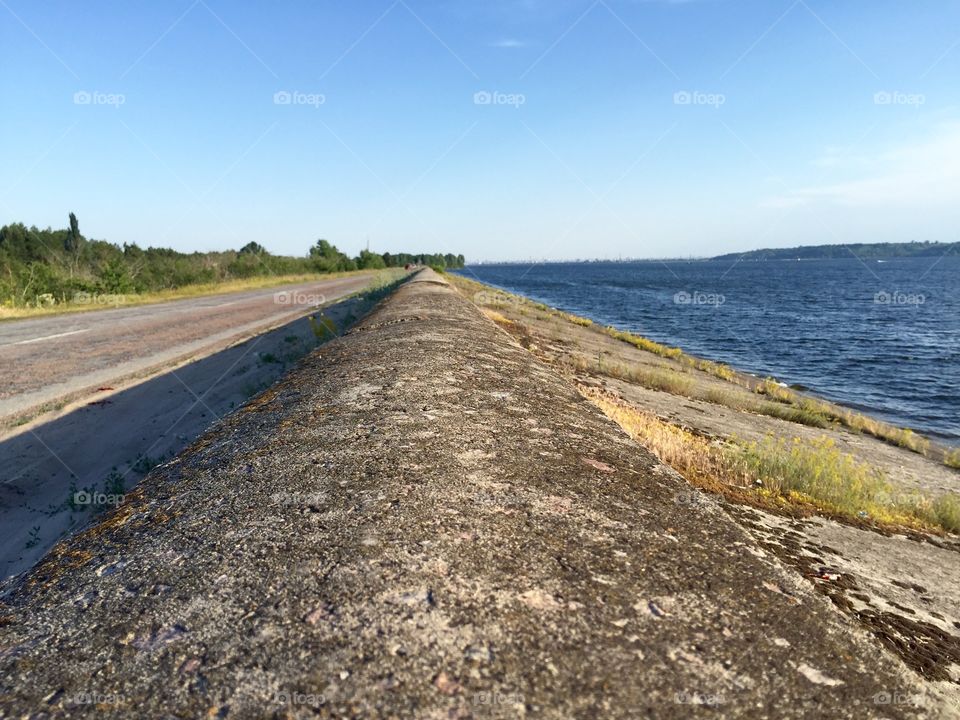 On the edge between the sea and road