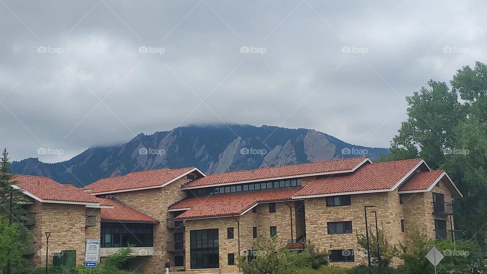 foggy mountain behind campus building