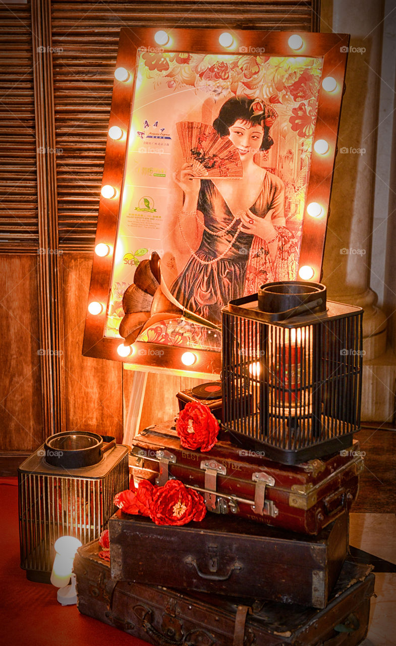 Suitcase and illuminated photograph at night