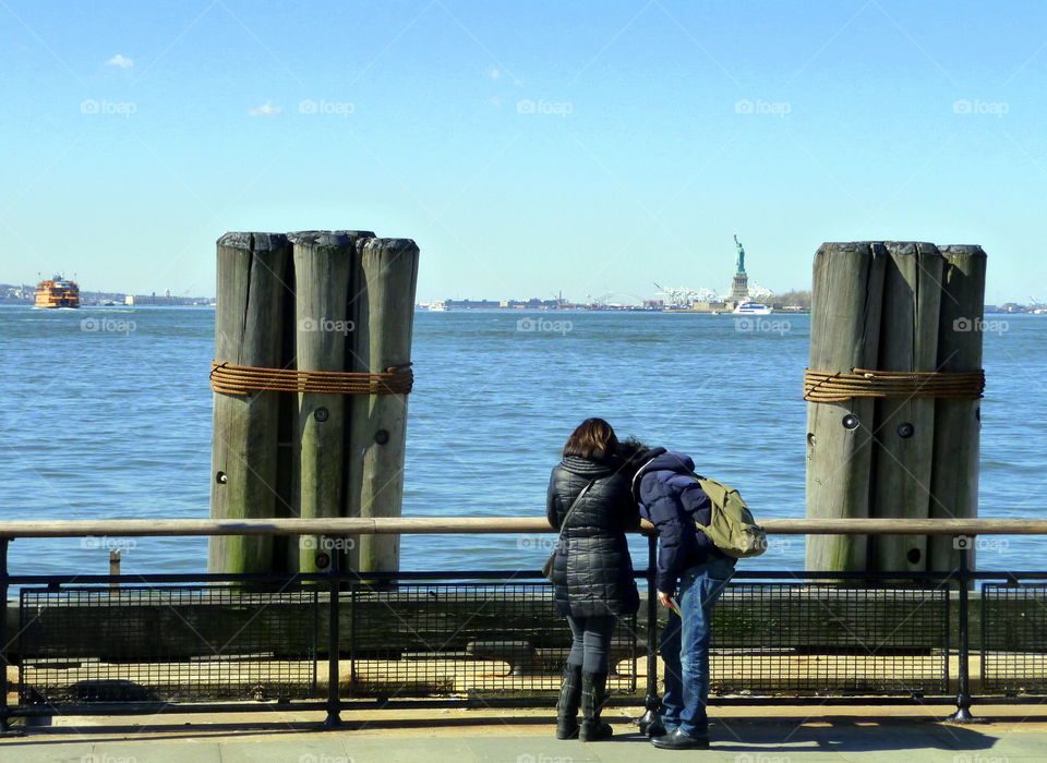 two looking the just made picture to the statue of liberty in new york