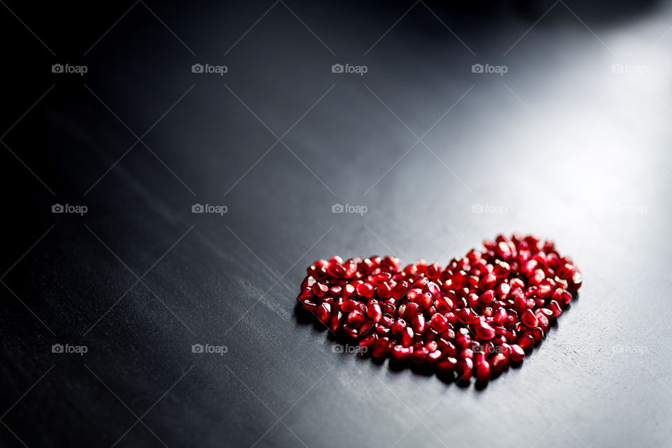 Pomegranate grains in hearth shape